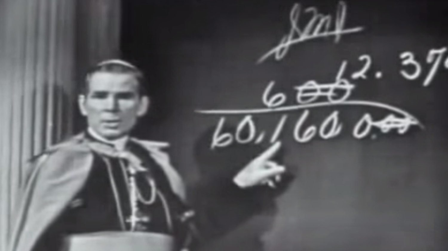 Bishop Sheen at the blackboard during Life Is Worth Living